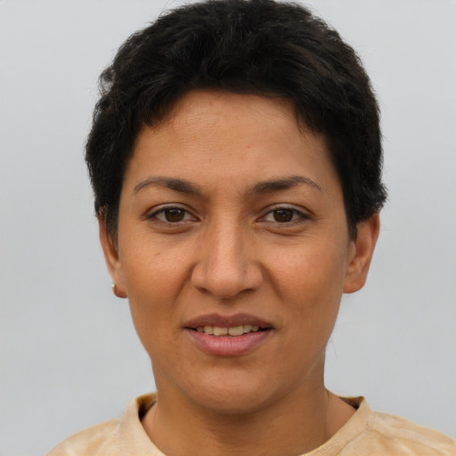 Joyful latino young-adult female with short  brown hair and brown eyes