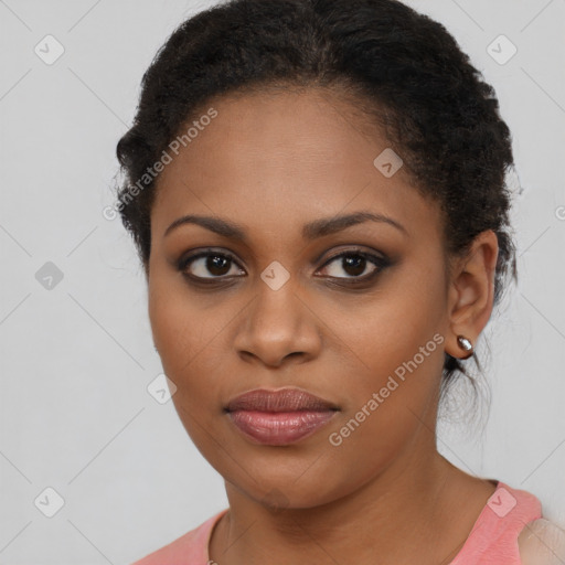 Joyful black young-adult female with long  brown hair and brown eyes