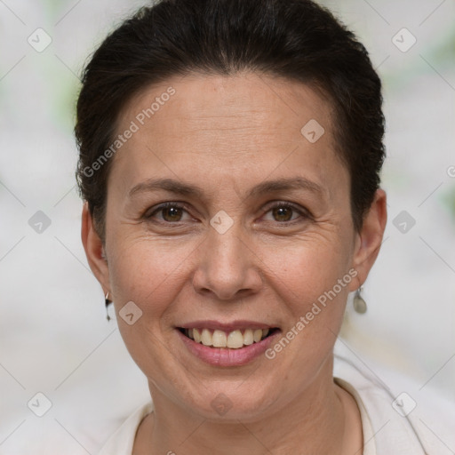 Joyful white adult female with short  brown hair and brown eyes