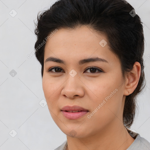 Joyful latino young-adult female with medium  brown hair and brown eyes