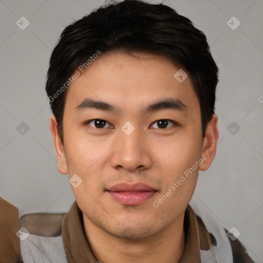 Joyful asian young-adult male with short  brown hair and brown eyes