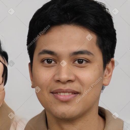 Joyful asian young-adult male with short  black hair and brown eyes