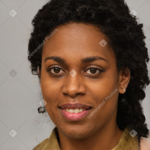 Joyful black young-adult female with long  brown hair and brown eyes