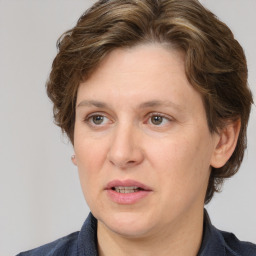 Joyful white adult female with medium  brown hair and brown eyes