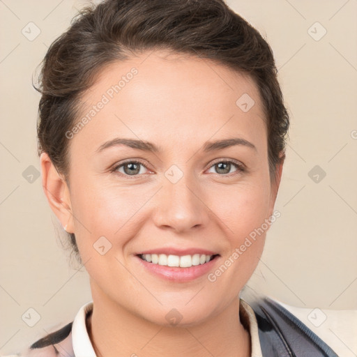 Joyful white young-adult female with short  brown hair and brown eyes