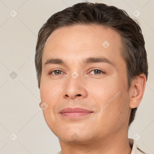 Joyful white young-adult male with short  brown hair and brown eyes