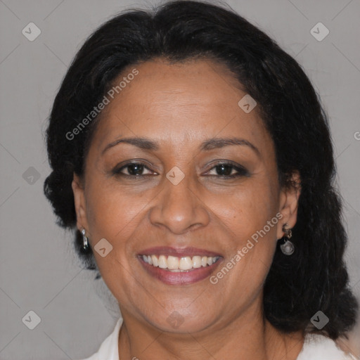 Joyful black adult female with medium  brown hair and brown eyes