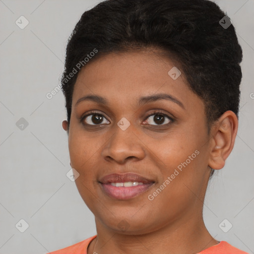 Joyful black young-adult female with short  brown hair and brown eyes