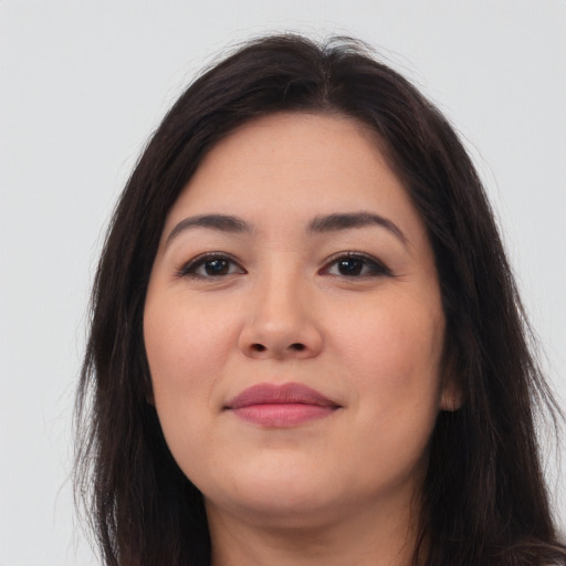 Joyful latino young-adult female with long  brown hair and brown eyes