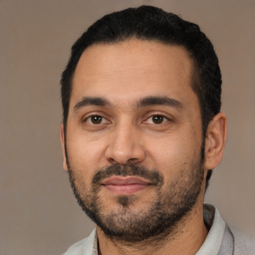 Neutral latino young-adult male with short  black hair and brown eyes