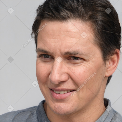 Joyful white adult male with short  brown hair and brown eyes