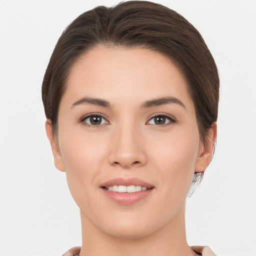 Joyful white young-adult female with short  brown hair and brown eyes