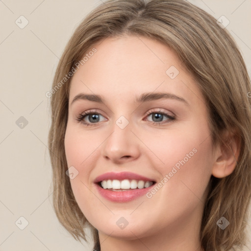 Joyful white young-adult female with long  brown hair and green eyes