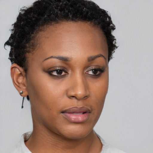 Neutral black young-adult female with short  brown hair and brown eyes