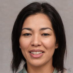 Joyful asian young-adult female with medium  brown hair and brown eyes