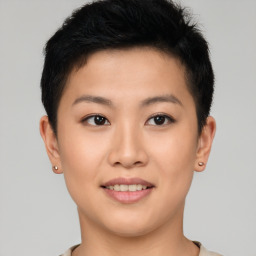 Joyful asian young-adult female with short  brown hair and brown eyes