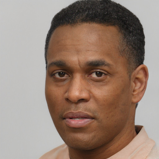 Neutral black young-adult male with short  brown hair and brown eyes