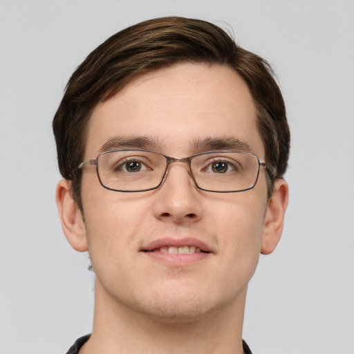 Joyful white young-adult male with short  brown hair and green eyes