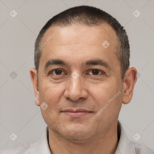 Joyful white adult male with short  brown hair and brown eyes