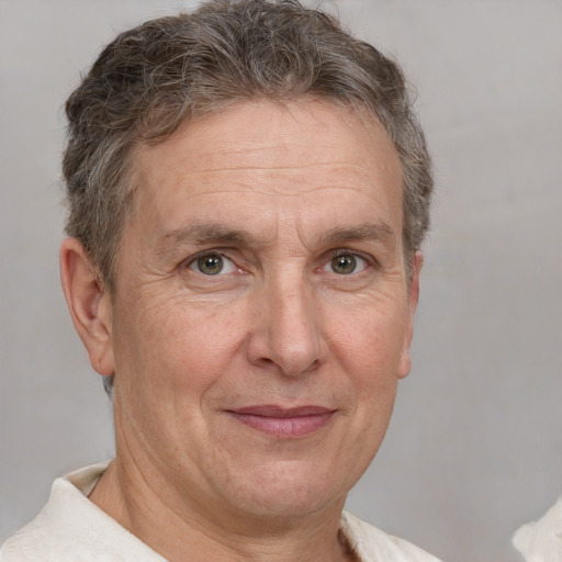 Joyful white middle-aged male with short  brown hair and brown eyes