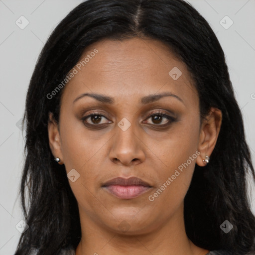 Joyful latino young-adult female with long  brown hair and brown eyes