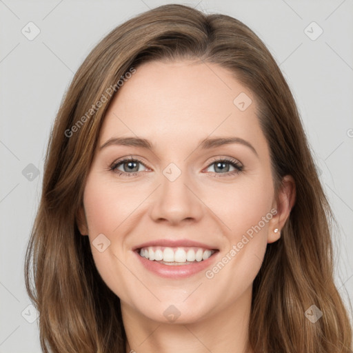 Joyful white young-adult female with long  brown hair and grey eyes