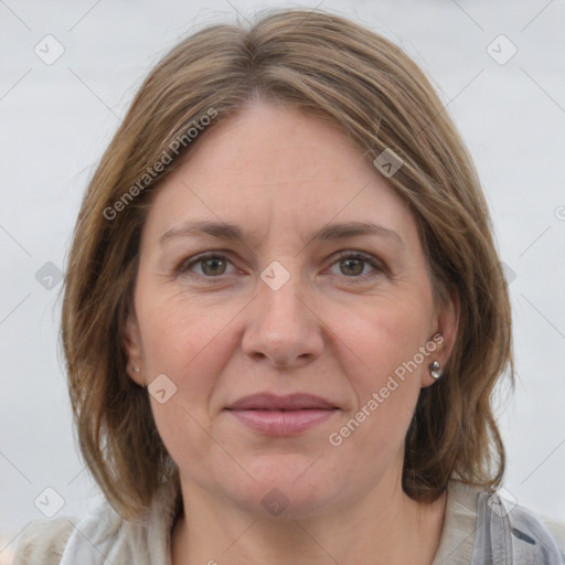 Joyful white adult female with medium  brown hair and grey eyes