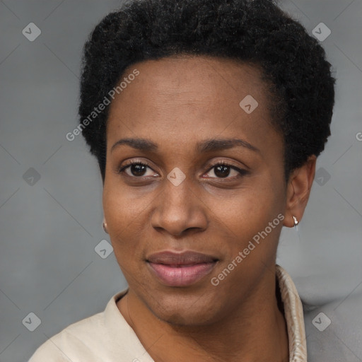 Joyful black young-adult female with short  black hair and brown eyes