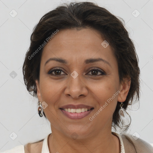 Joyful latino adult female with medium  brown hair and brown eyes