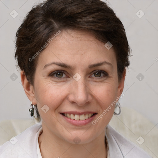 Joyful white adult female with short  brown hair and grey eyes