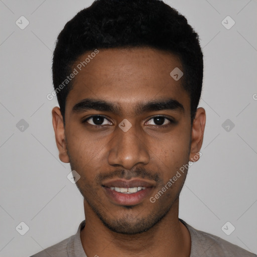 Joyful black young-adult male with short  black hair and brown eyes