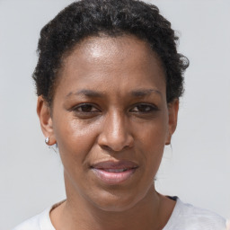 Joyful black adult female with short  brown hair and brown eyes