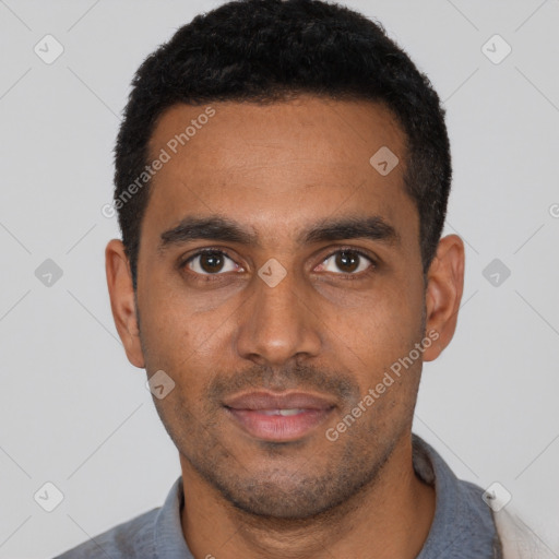 Joyful black young-adult male with short  black hair and brown eyes