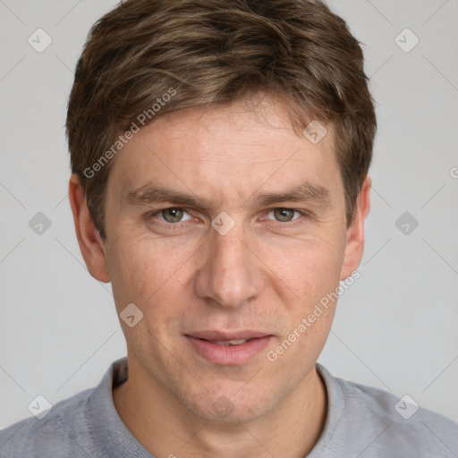 Joyful white adult male with short  brown hair and grey eyes