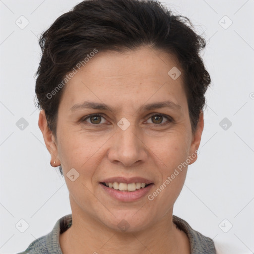 Joyful white adult female with short  brown hair and brown eyes