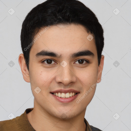 Joyful latino young-adult male with short  brown hair and brown eyes