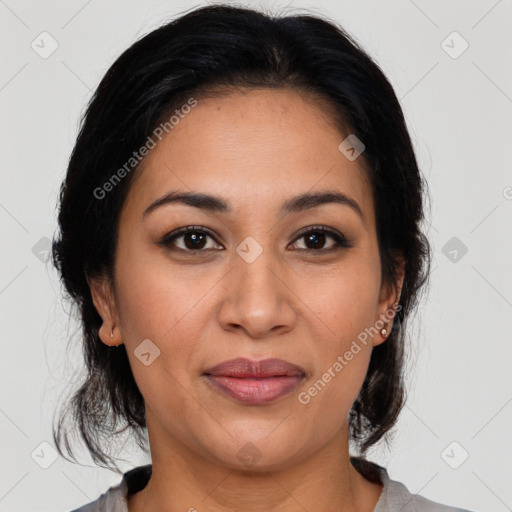 Joyful latino young-adult female with medium  brown hair and brown eyes