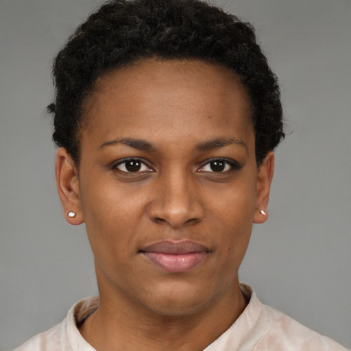 Joyful black young-adult female with short  brown hair and brown eyes