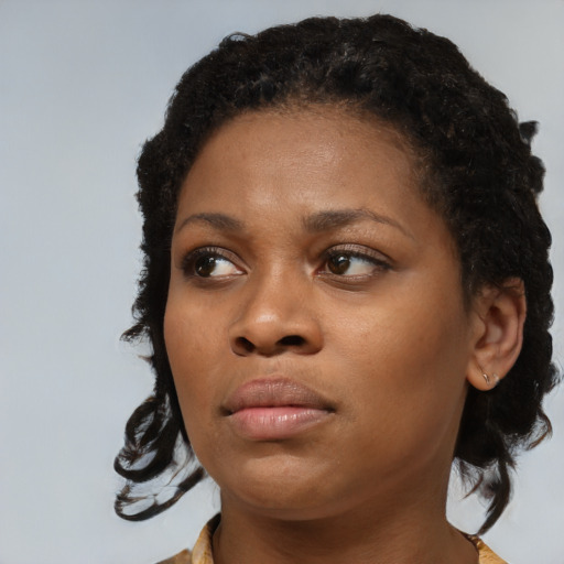 Neutral black young-adult female with medium  black hair and brown eyes