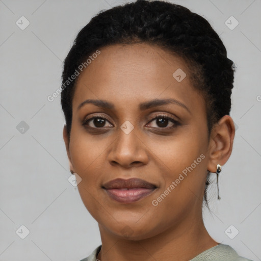 Joyful black young-adult female with short  black hair and brown eyes