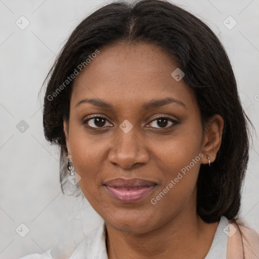 Joyful black young-adult female with medium  brown hair and brown eyes