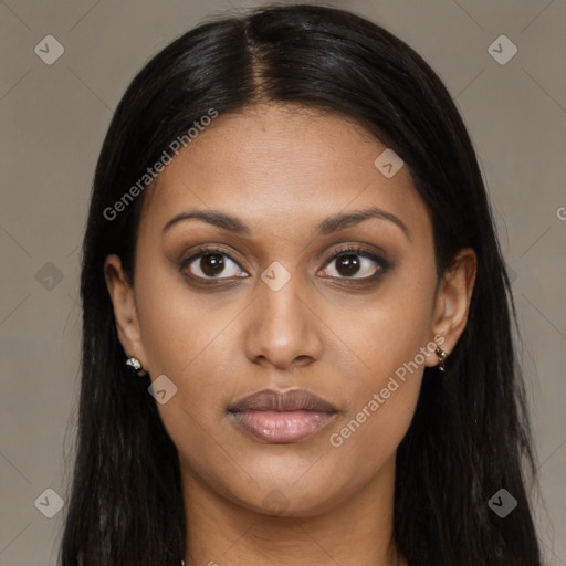 Joyful black young-adult female with long  brown hair and brown eyes