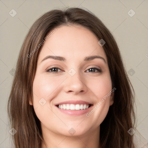 Joyful white young-adult female with long  brown hair and green eyes