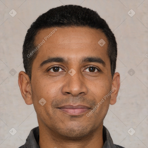 Joyful latino young-adult male with short  black hair and brown eyes