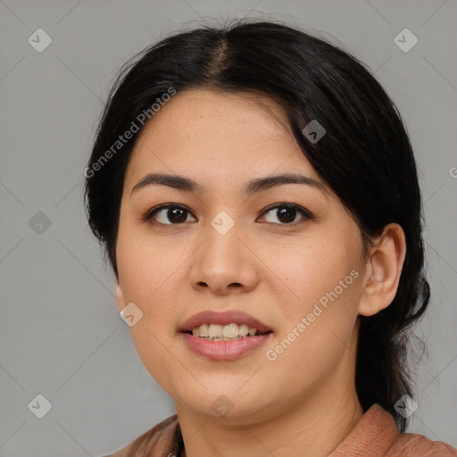 Joyful asian young-adult female with medium  black hair and brown eyes