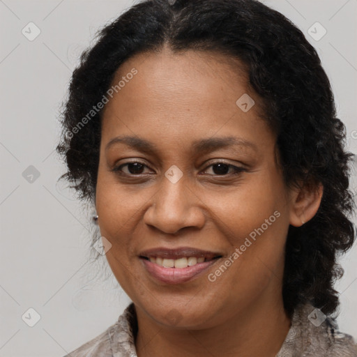 Joyful black young-adult female with long  brown hair and brown eyes