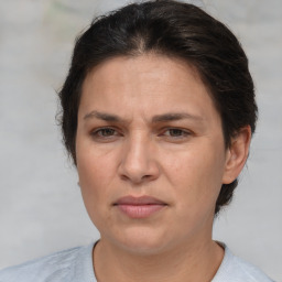 Joyful white adult female with short  brown hair and brown eyes