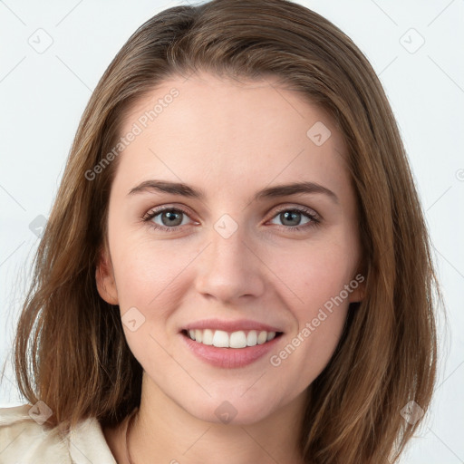 Joyful white young-adult female with medium  brown hair and blue eyes