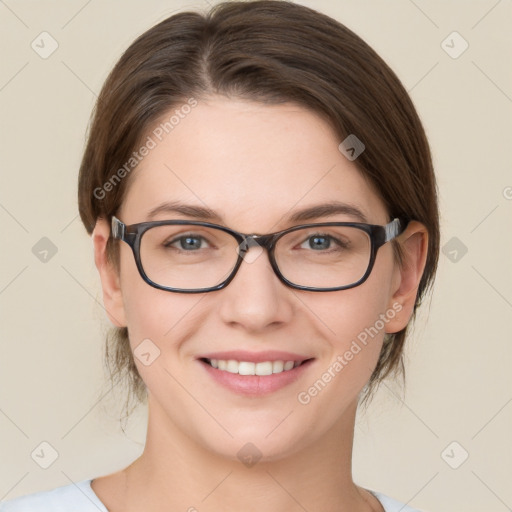 Joyful white young-adult female with medium  brown hair and green eyes