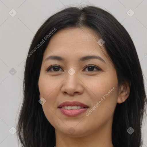 Joyful asian young-adult female with long  brown hair and brown eyes